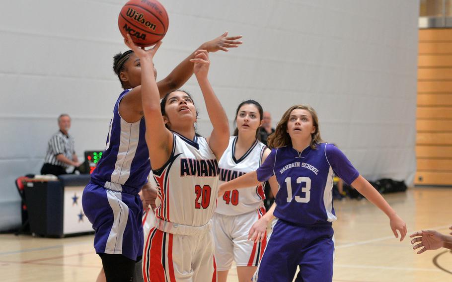 Aviano's Allana Vasquez gets past Bahrain's Kennedy Sawyer in a Division II game at the DODEA-Europe basketball championships in Wiesbaden, Germany, Wednesday, Feb. 19, 2020. Aviano won the game 30-12.