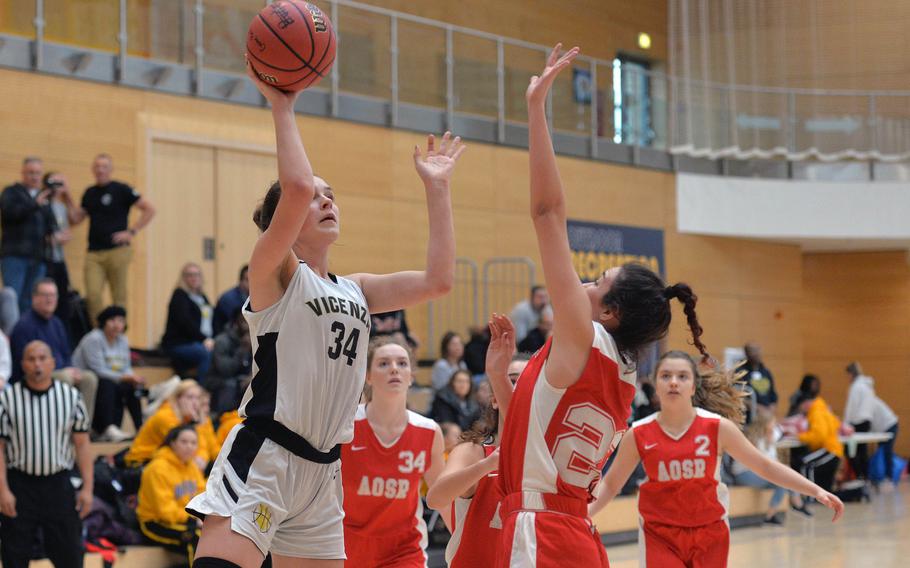 Vicenza's Claire Troiano shoots over AOSR's Maria Rossi in a Division II game won by Vicenza 42-36, at the DODEA-Europe basketball championships in Wiesbaden, Germany, Wednesday, Feb. 19, 2020. 