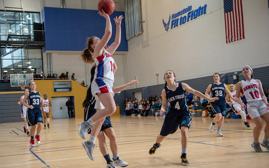 Ramstein's Alexis Tri takes a shot during a game against Black Forest Academy during the DODEA-Europe 2020 Division I basketball playoffs at the Southside gym on Ramstein Air Base, Germany, Wednesday, Feb. 19, 2020. 