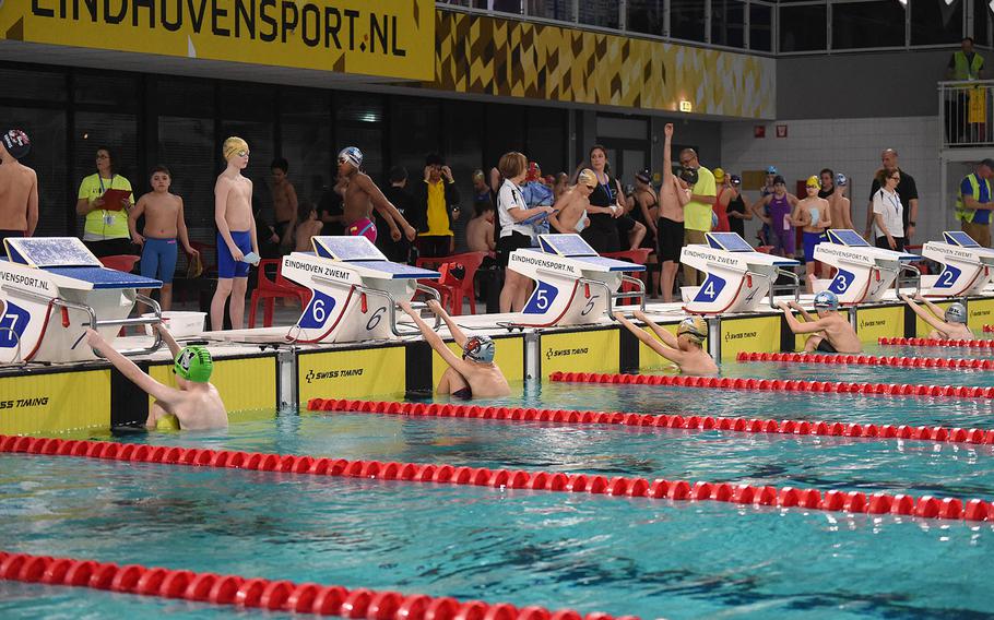 Swimmers get ready to begin the boys 50-meter backstroke during the European Forces Swim League championships in Eindhoven, Netherlands, Sunday, March 1, 2020.