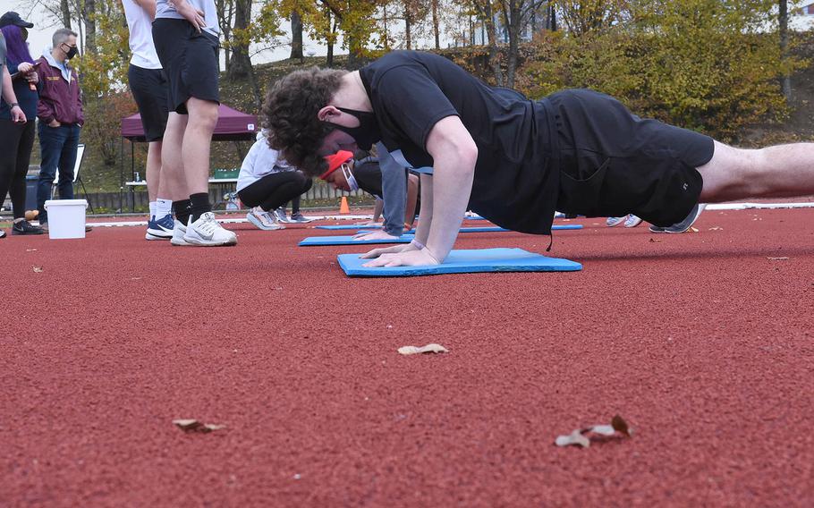 Vilseck's Nicolas Holcomb, right, participates during the pushups event at the European Athletic Fitness Games championships at Vilseck, Germany on Saturday, Oct. 31, 2020.