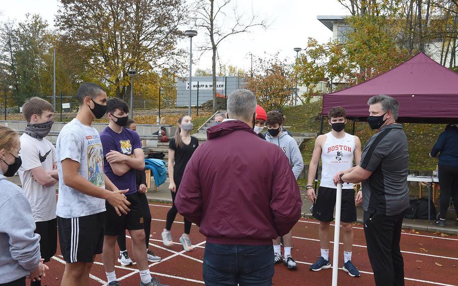 Coach Brian Swenty, right, speaks to competitors before the start of the European Athletic Fitness Games championships at Vilseck, Germany on Saturday, Oct. 31, 2020.
