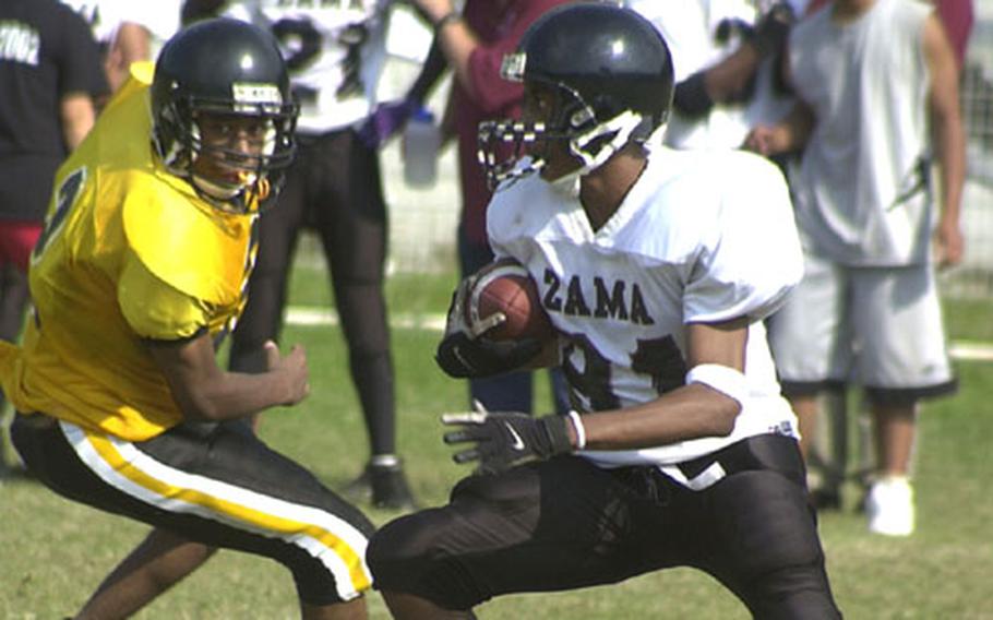 Zama American wide receiver Corey Stacy (81) looks for running room against American School In Japan defender Scotty Bolling (2) during Saturday’s Kanto Plain Association of Secondary Schools game at Mustang Valley, Tokyo. Stacy caught three touchdown passes, two on tipped balls, as the Trojans blanked the Mustangs 48-0.