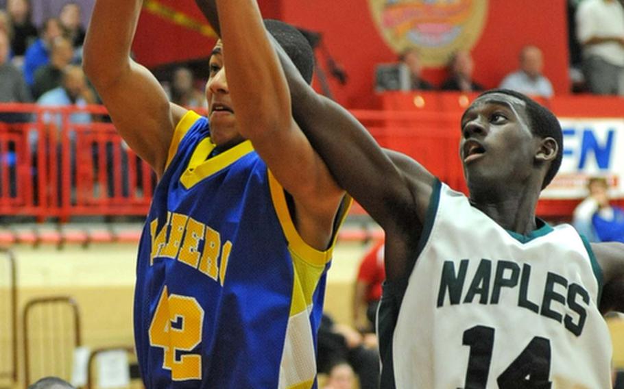 Bamberg's T. J. Cortwright  and Nigel Alexander of Naples fight for a rebound in a Division II semifinal won by Bamberg, 51-44. The Barons will play Hohenfels on Saturday in the championship game.