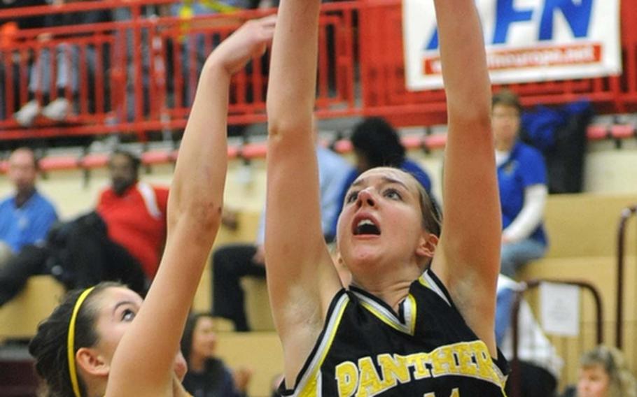 Patch's Johanna Quinn, right shoots over Wiesbaden's Taylor Dore in the Lady Panthers' 41-31 semifinal win over Wiesbaden.
