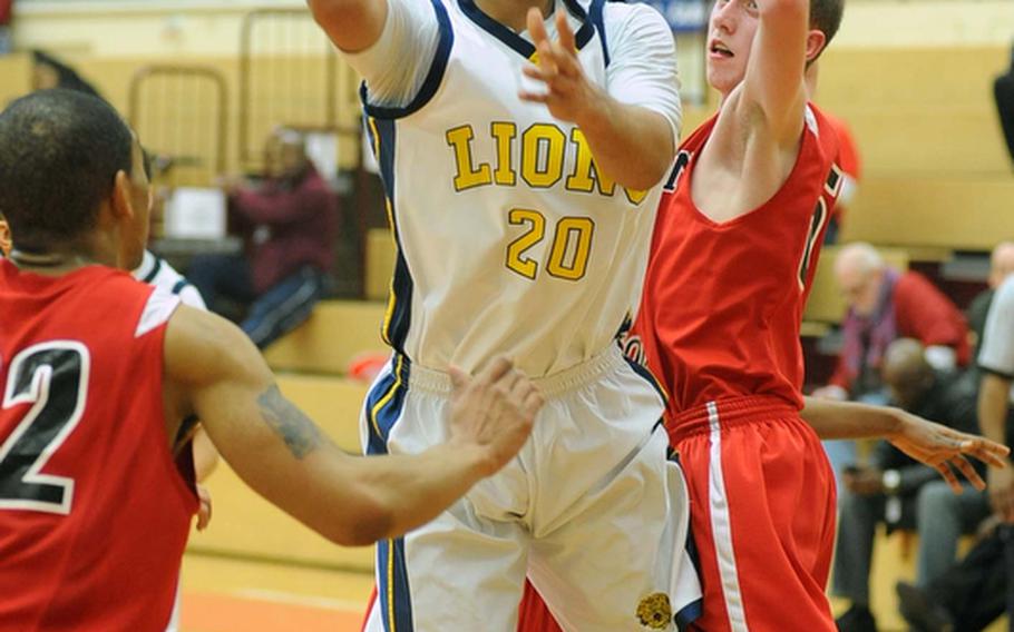 Heidelberg's Chris Cuthbert gets past Kaiserslautern's Andrew Stern to go in for a basket in the Lions' 71-39 semifinal win over Kaiserslautern on Friday night.