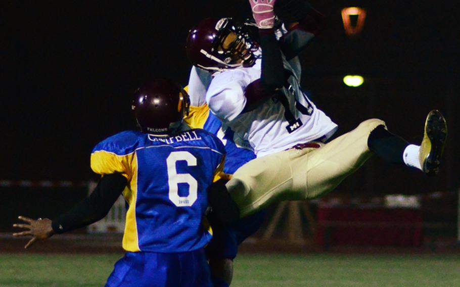 Ben McDaniels of Baumholder, playing for the North All Star Squad makes an athletic attempt to pull down a pass in the DODDS-Europe high school football all-star game Saturday night.
