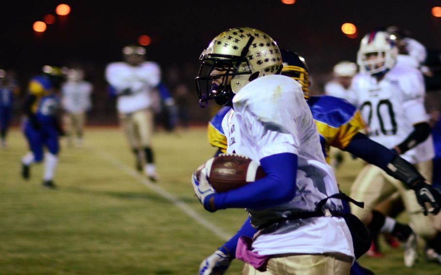 Daniel Harris of Wiesbaden, playing for the North All Star Squad, gets around the corner on his way to the end zone in the DODDS-Europe high school football all star game.