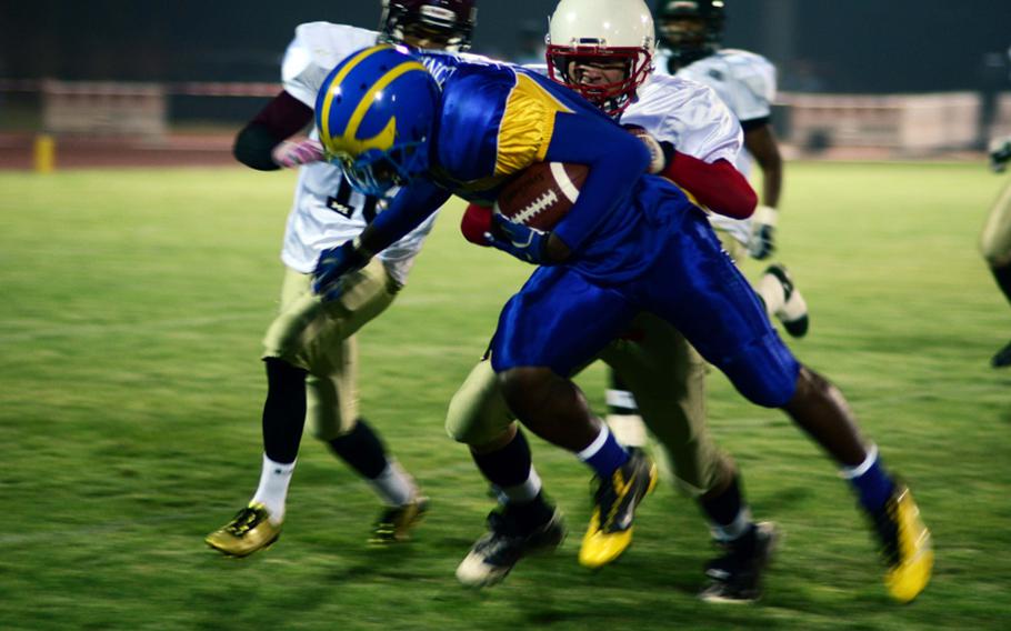 Xavier Jones of Ansbach, playing for the South All Star Squad, picks up yardage in the first half of the DODDS-Europe high school football all star game.