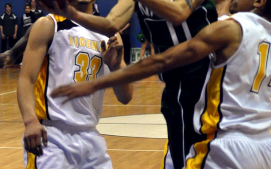 Naples point guard Jun Jun Gallardo splits the Vicenza defense to score two of his 12 points Friday night in the Wildcats' 82-52 triumph over Vicenza.