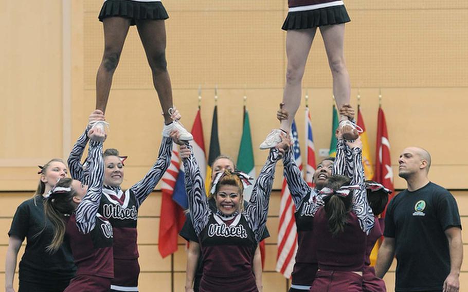 The Vilseck Falcons cheer team build a pyramid during their routine at the DODDS-Europe cheerleading championships.
