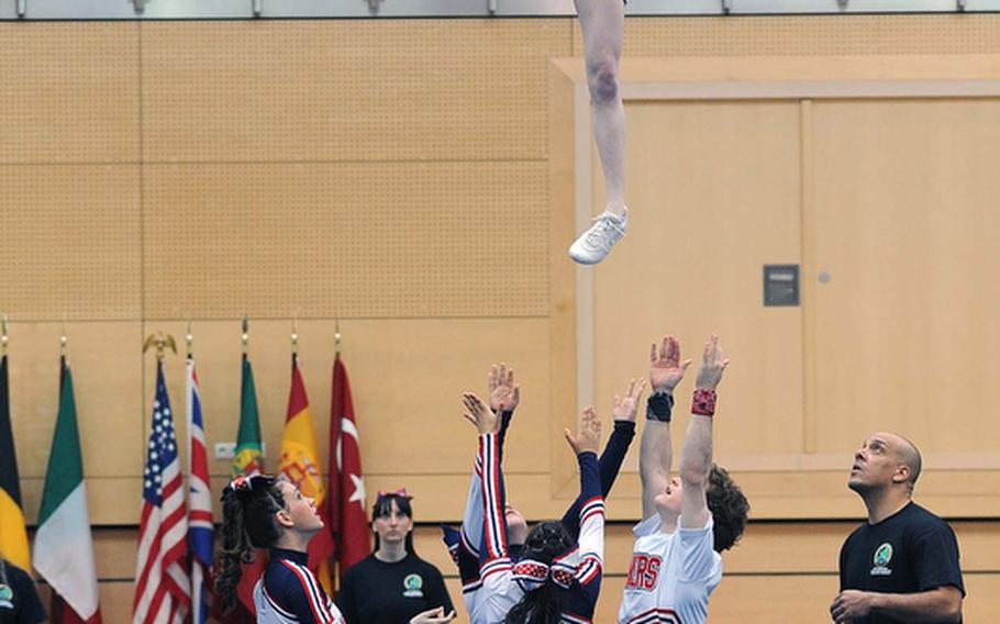 A Lakenheath Lancer flies high as the school's  cheer team perform their routine at the DODDS-Europe cheerleading championships in Wiesbaden, Saturday. The Lancers captured the Division I title ahead of Kaiserslautern and Patch.