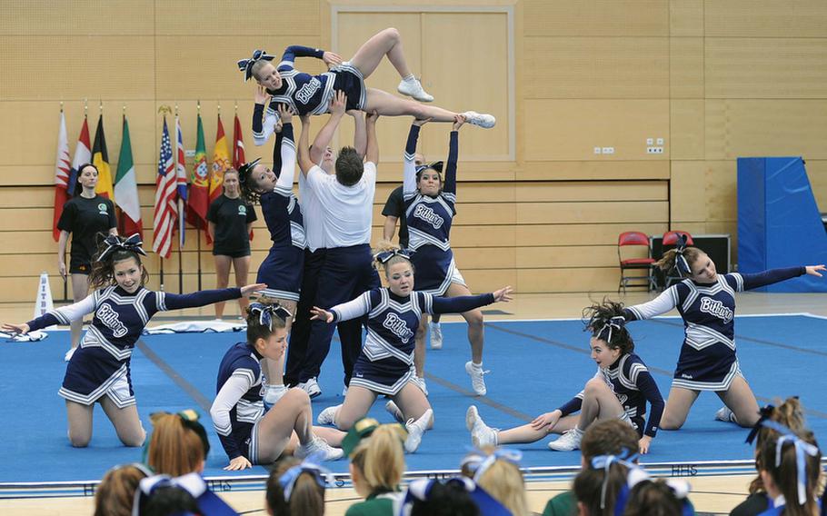 Fellow competitors watch the Bitburg Barons cheer team perform their routine at the DODDS-Europe cheerleading championships.
