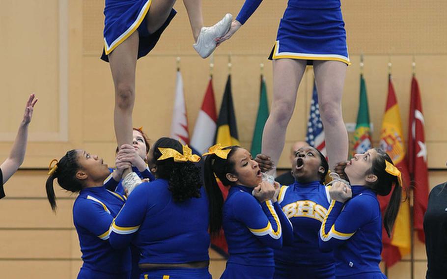 The Bamberg Barons cheer squad do a stunt at the DODDS-Europe cheerleading championships.