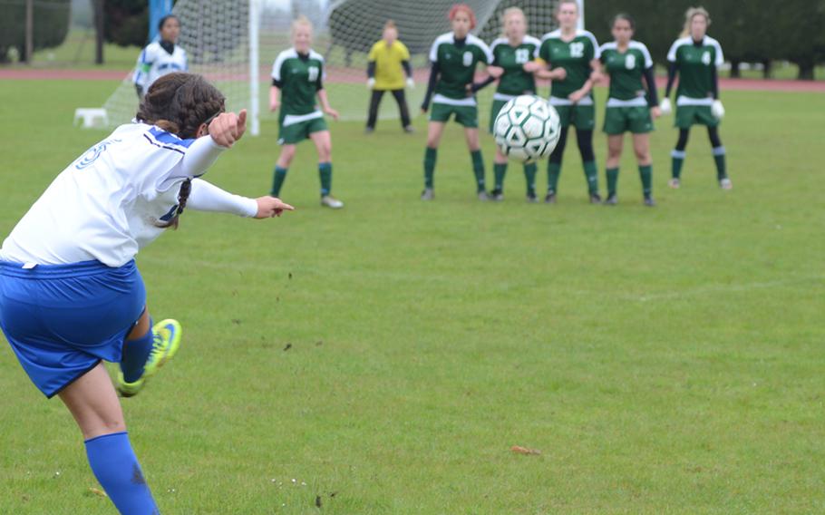 Rota's Keanna Garcia boots a free kick towards the goal during a match against the Alconbury Lady Dragons on Friday in England. Garcia scored the only two goals in the contest. 
