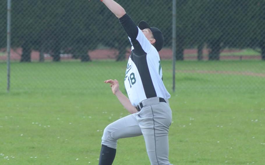 Alconbury's Beau Hocevar catches a pop-fly during a game against SHAPE, Friday at RAF Alconbury, England. The Dragons lost both games of the doubleheader against the Spartans by scores of 13-4 and 4-0.