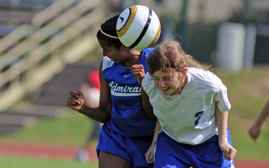 Aleeza Vitale of Brussels, right, heads the ball away from Rota's Diana Santana in the Division III finals at the DODDS-Europe soccer championships. Brussels took the title with a 2-1 win.


