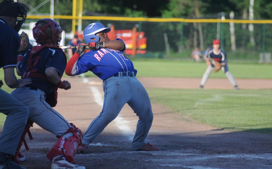 Ramstein's Caleb Guerrido dodges a pitch from Lakenheath's Taylor Portman during a Friday Division I semifinal game at the DODDS European baseball championships.