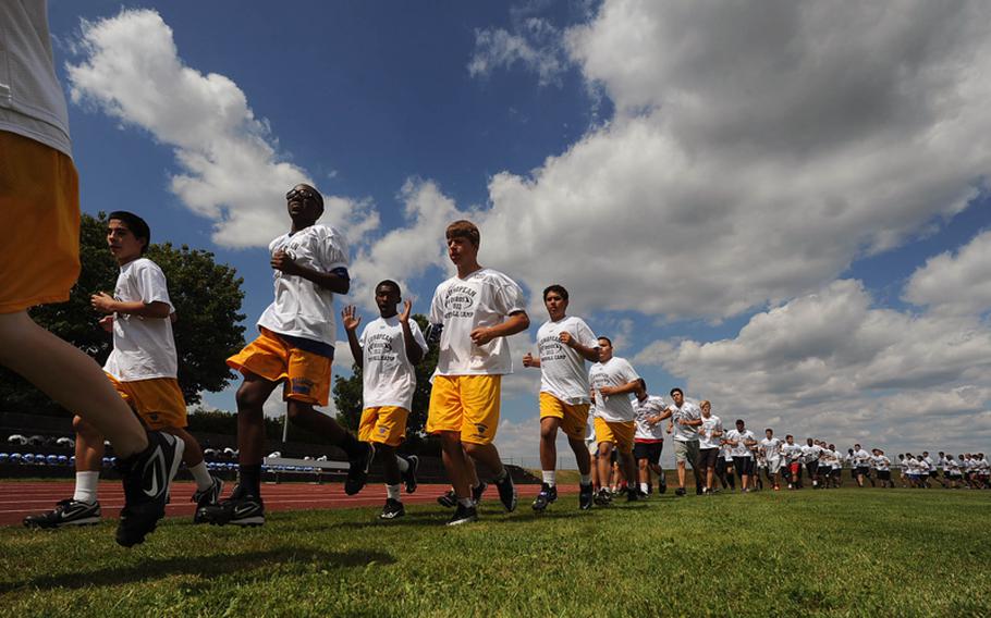 Players run laps at the beginning of the afternoon session Aug. 13, 2012, at the DODDS European Football Camp in Ansbach, Germany, on Monday. Around 340 players turned out for this year's camp.