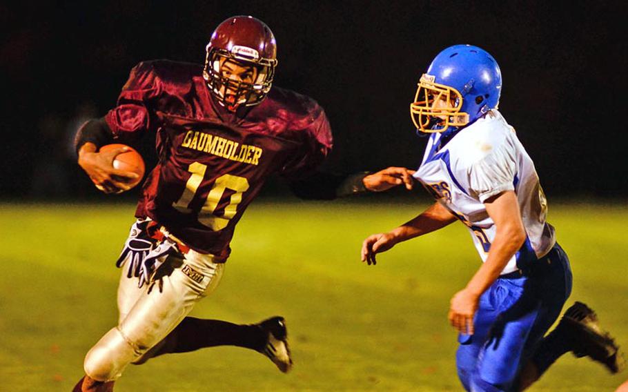 Baumholder's Ben McDaniels tries to get by Sigonella's Eli Lagger Saturday night in the Buccaneer's 42-14 DODDS-Europe Division III victory over the Sigonella Jaguars.