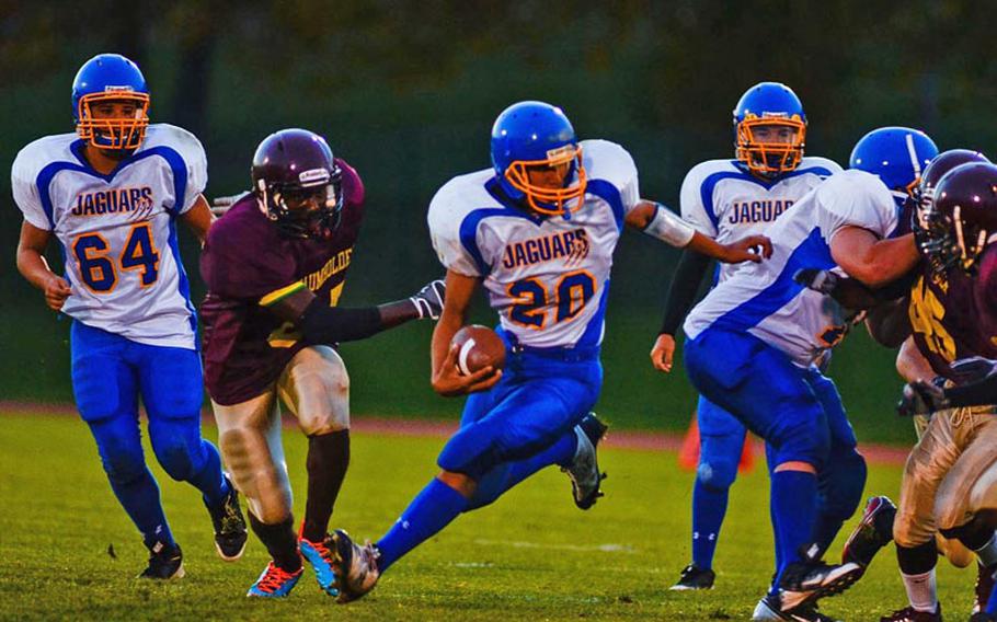 Sigonella's Antonio Garda cuts back for some yardage in Saturday night's 42-14 DODDS-Europe Division III playoff loss against Baumholder.