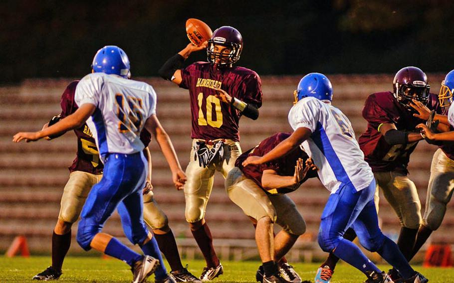 Baumholder's Ben McDaniels throws a quick pass Saturday night in the Buccaneer's 42-14 DODDS-Europe Division III victory over the Sigonella Jaguars.
