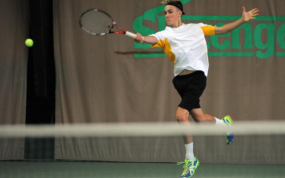Vicenza's Mackenzie Roche makes a leaping return on a shot by SHAPE's Dimitrios Stavropoulos in a quarterfinal match at the DODDS-Europe tennis championships, Friday. Roche lost 6-1, 6-0.