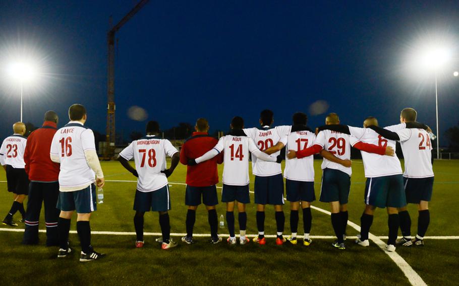 Vicenza players pull together late night Oct. 28, 2012, in the U.S. Forces Europe soccer championship in Wiesbaden, Germany. Vicenza ended up loosing the game to Ramstein after an overtime and a shootout. 