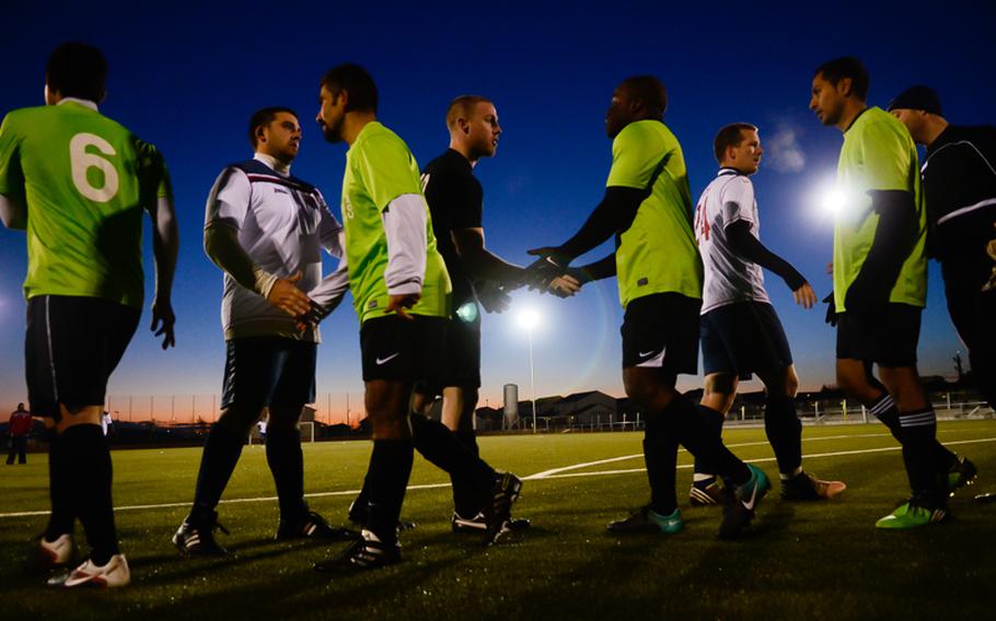 Players from Ramstein, green, and Vicenza shake hands after Ramstein beat Vicenza in a rematch of last year's U.S. Forces Europe soccer championship with an overtime and a shootout Oct. 28, 2012, in Wiesbaden, Germany.