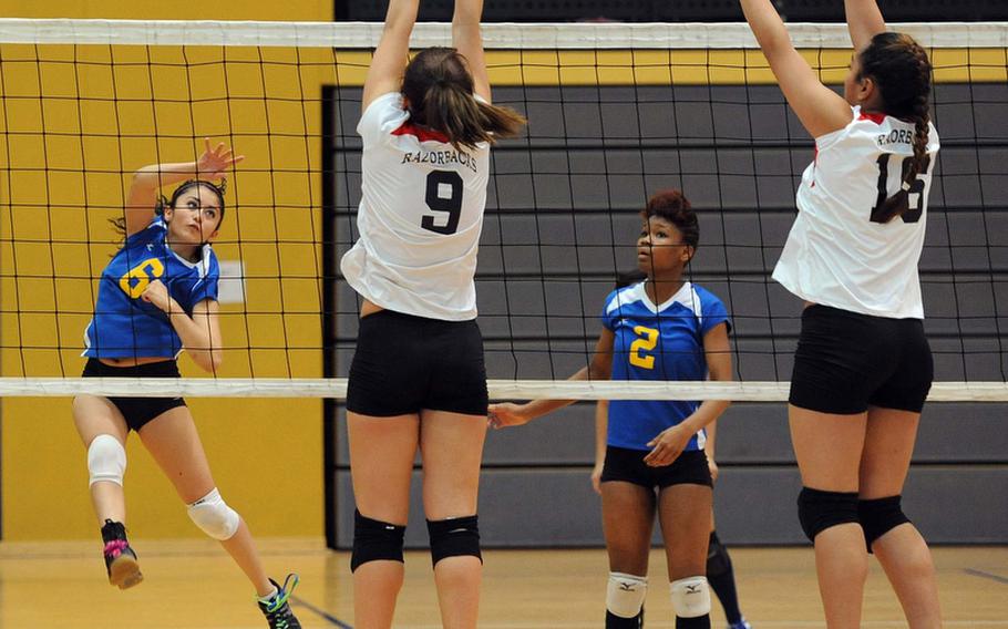 Ansbach's Jasmine Rodriguez watches her shot sail between the defense of Schweinfurt's Tricia Valverde, left, and Maria Maika, as teammate Caprice Lockett watches in a Division II match at the DODDS-Europe volleyball championships. Ansbach won the match 25-22, 25-9.