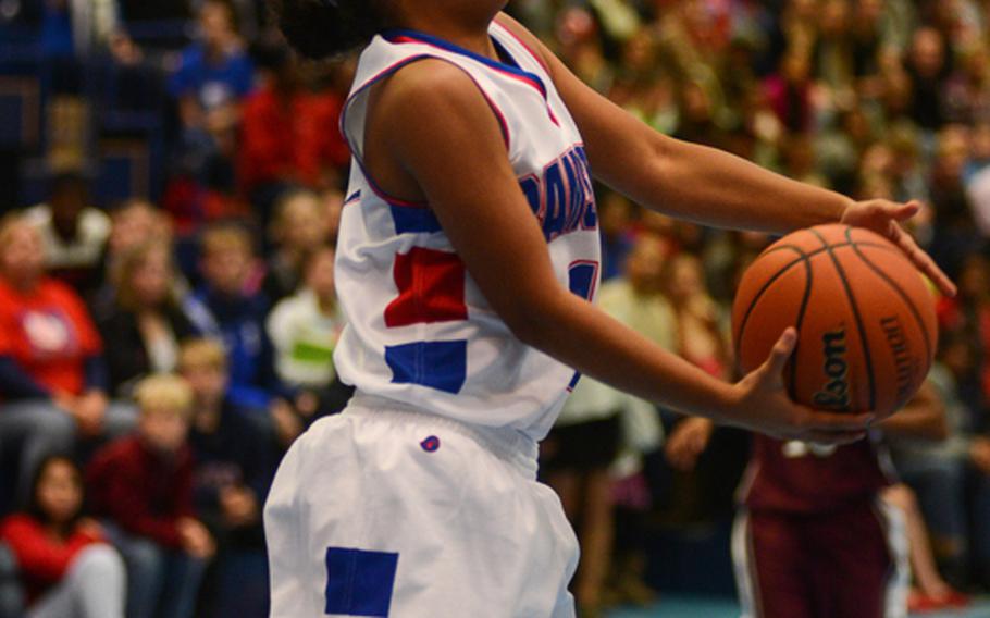 Ramstein High School's Breanna Martinez makes an athletic layup Friday night in Ramstein's win against Vilseck High School at Ramstein Air Base.