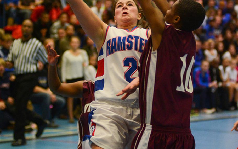 Ramstein High School's Addison Ptomey makes a tough move for two Friday night as her team defeated Vilseck High School at Ramstein Air Base.