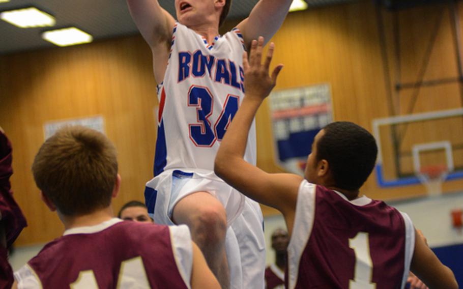 Ramstein High School's Jesse Gray swoops in for a layup Friday night as his team defeated Vilseck High School at Ramstein Air Base.
