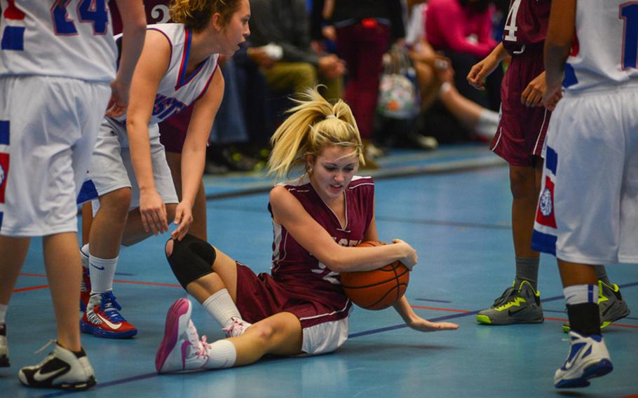 Vilseck High School's Autumn Cole takes control of a loose ball Friday night in her team's loss to Ramstein High School at Ramstein Air Base.