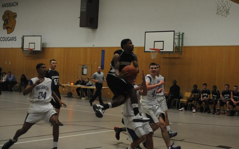 Schweinfurt's Lajuarren Banks leaps before taking his shot during a game Friday in Ansbach, Germany. Schweinfurt won 48-36.