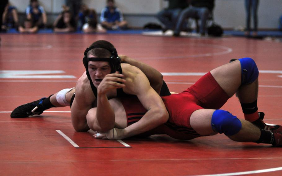 Vicenza’s Liam Manville, top, and Aviano’s Alex Ramos fight for first place in the 152-pound weight class at the southern sectionals in Aviano. Manville took first place by a major decision against Ramos, 17-5, guaranteeing his spot at the European finals.