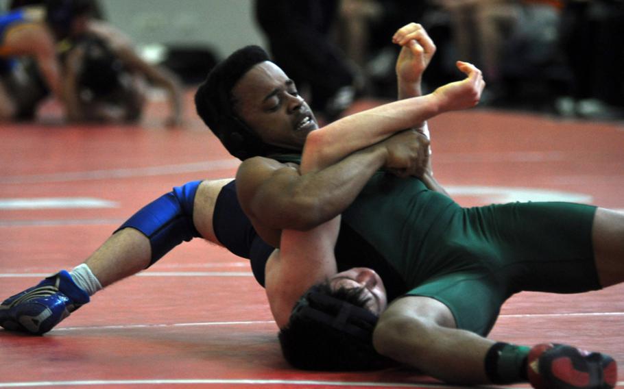 Naples’ Miles Davis gets set to pin Josh Wenger of Black Forest Academy during their 145-pound match at Aviano. Davis placed first for his weight class after beating Daniel Dinges from Aviano 7-5 in the championship.