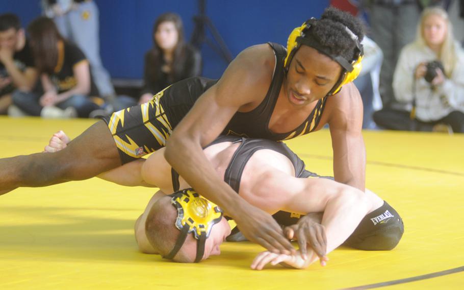 Patch senior Desean Horton wrestles junior Tristan Bowman during a 152-pound round robin  match at the Eastern Sectional held at Patch on Saturday. Horton won the match.