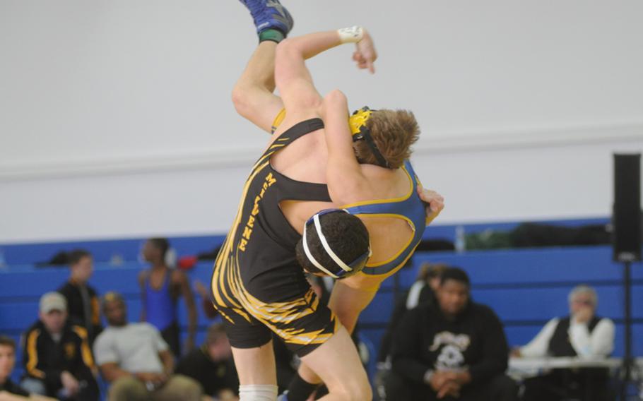 Patch senior Isaac McIlvene tosses Ansbach freshman Shawn McDonald during a 126-pound round robin match Saturday at Patch. McIlvene won the match. McDonald was third place in his weight class but could go to Europeans as a wild card.