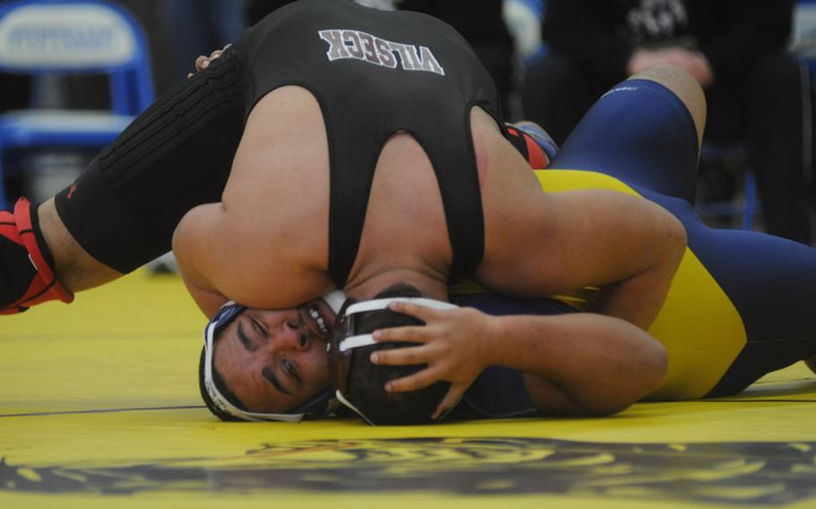 Vilseck junior Armando Saldana pins Ansbach senior Rahim Beatty during a 285-pound round robin match Saturday at Patch. According to Beatty, it was the first time Saldana beat him and Beatty's first loss of the season. Both will move on to Europeans.