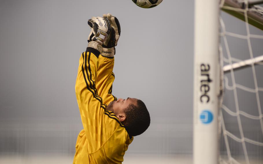 Zak Johnson, Vilseck's goalie, deflects the ball for a save Saturday afternoon against Kaiserslautern at Vogelweh, Germany. Kaiserslautern defeated visiting Vilseck 4-1.
