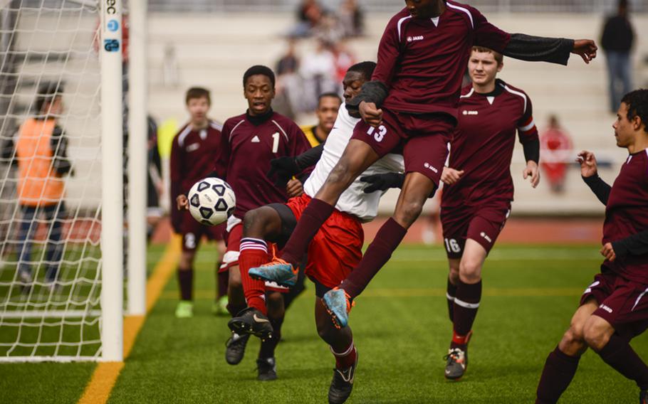 Vilseck's Abdullah Johnson plays some high flying defense against Kaiserslautern's Stephen Adjei Saturday afternoon at Vogelweh, Germany. Kaiserslautern defeated visiting Vilseck 4-1.