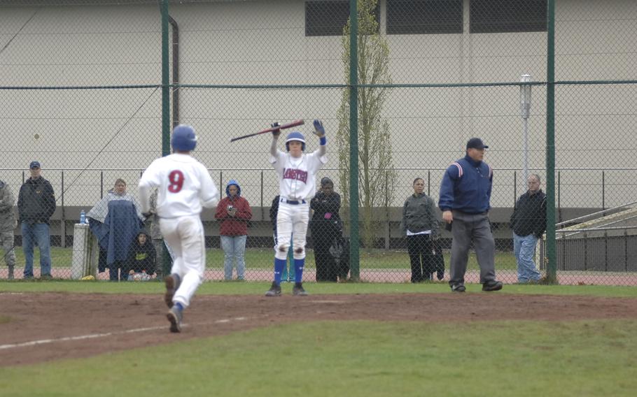 Ramstein's Woody Woodruff motions for teammate Patrick Young to score standing up in the Royals' 18-1 victory over Kaiserslautern on Friday.