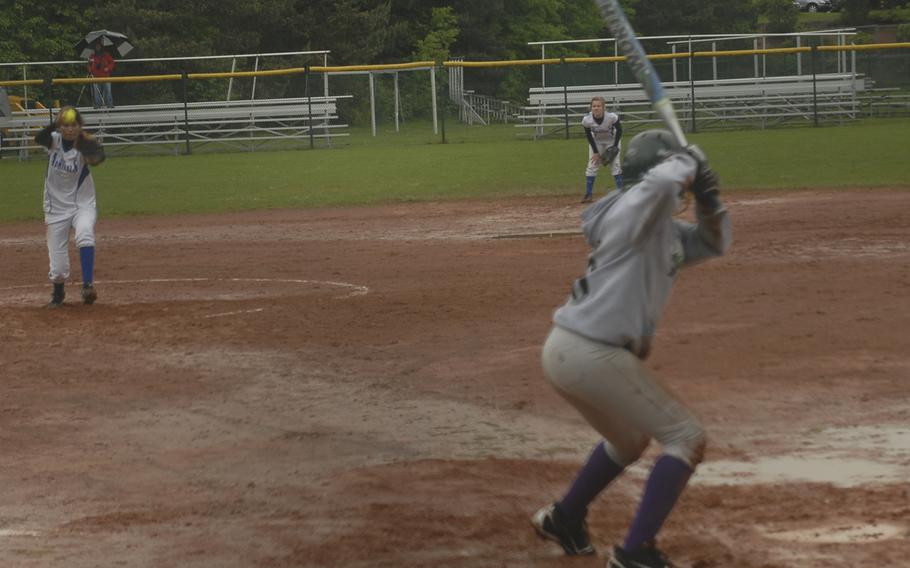 Rota pitcher Kasandra Velasco goes into her windup against Latavia Young of Alconbury on a muddy field at Ramstein Air Base on Thursday. Alconbury withstood a late rally by Rota to win 9-8 on the first of the three-day European softball championships. 