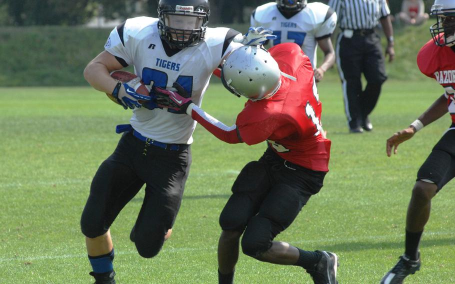 Hohenfels running back David Vidovic runs through a Schweinfurt/Bamberg tackle in Hohenfels' 38-14 victory Saturday at Schweinfurt, Germany. Vidovic scored four touchdowns on the day.