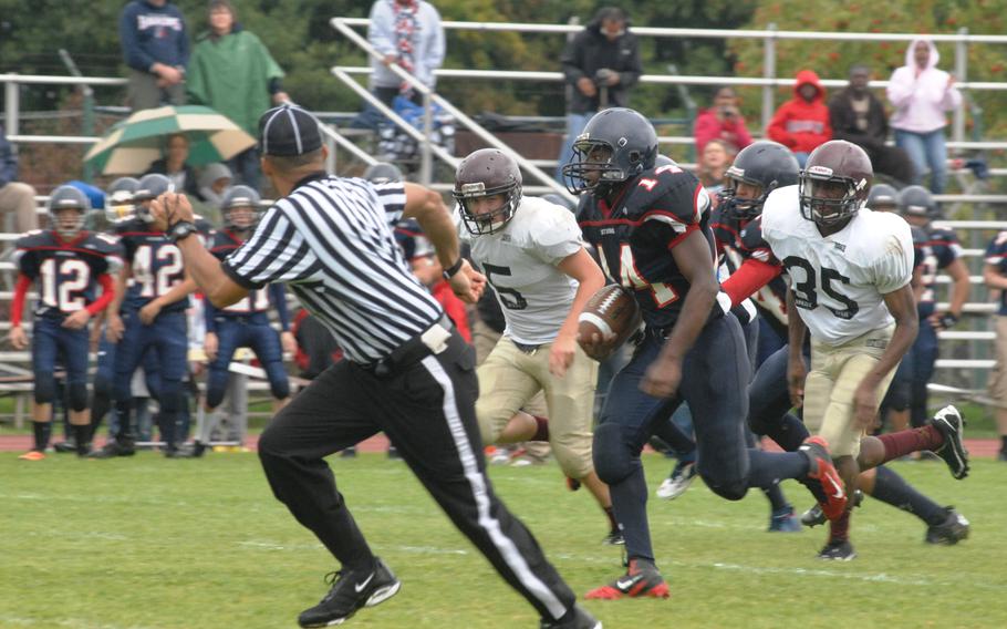 Bitburg running back Larry Jackson breaks free for a 57-yard second-quarter touchdown run against Baumholder on Saturday at Bitburg, Germany. Bitburg won the game 42-6 and set a new DODDS-Europe record with its 32nd consecutive victory.