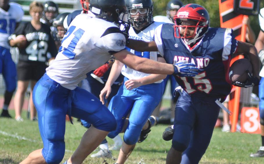 Aviano's Te'Kevin Boston tries to push by Hohenfels' David Vidovic during a game Saturday at Aviano Air Base, Italy. Hohenfels won 41-22.