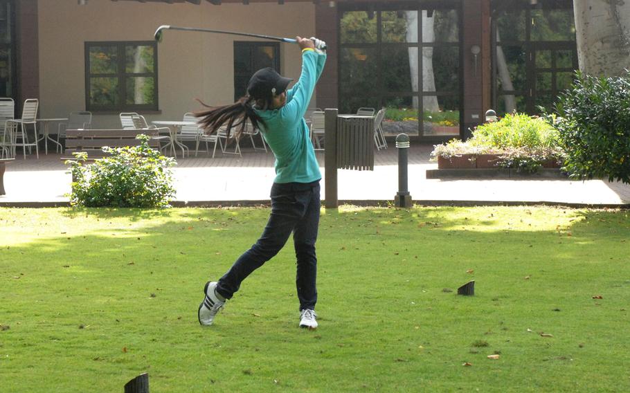 Bitburg sophomore Samantha Nop watches her tee shot Thursday at Woodlawn Golf Course at Ramstein Air Base, Germany.