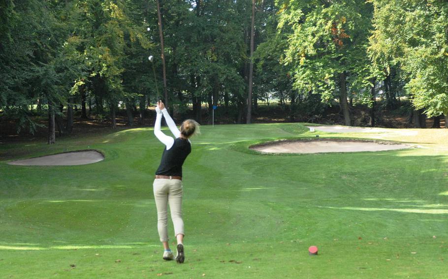 Patch golfer Meredith Stuber watches her tee shot on the par-three 10th hole Thursday at Woodlawn Golf Course at Ramstein Air Base, Germany.