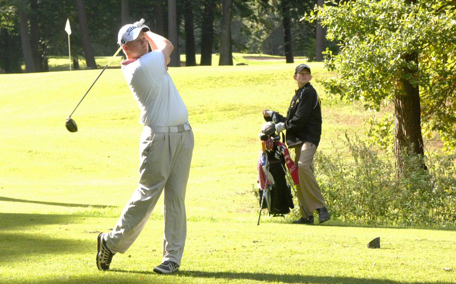 Kaiserslautern golfer Jeffery Kidwell tees off as Patch freshman Jordan Holifield watches Thursday at Woodlawn Golf Course at Ramstein Air Base, Germany.